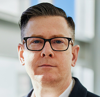 Photo d'Alexander Hughes, PDG et Directeur général d'une société spécialisée dans le trading de cryptomonnaies